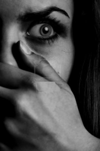 7140161-horror-monochrome-photo-of-the-afraid-woman-with-mouth-covered-by-hand copy